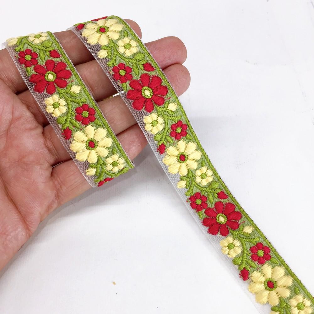 20mm Organza back flower creeper Jacquard trim, shown on white cotton