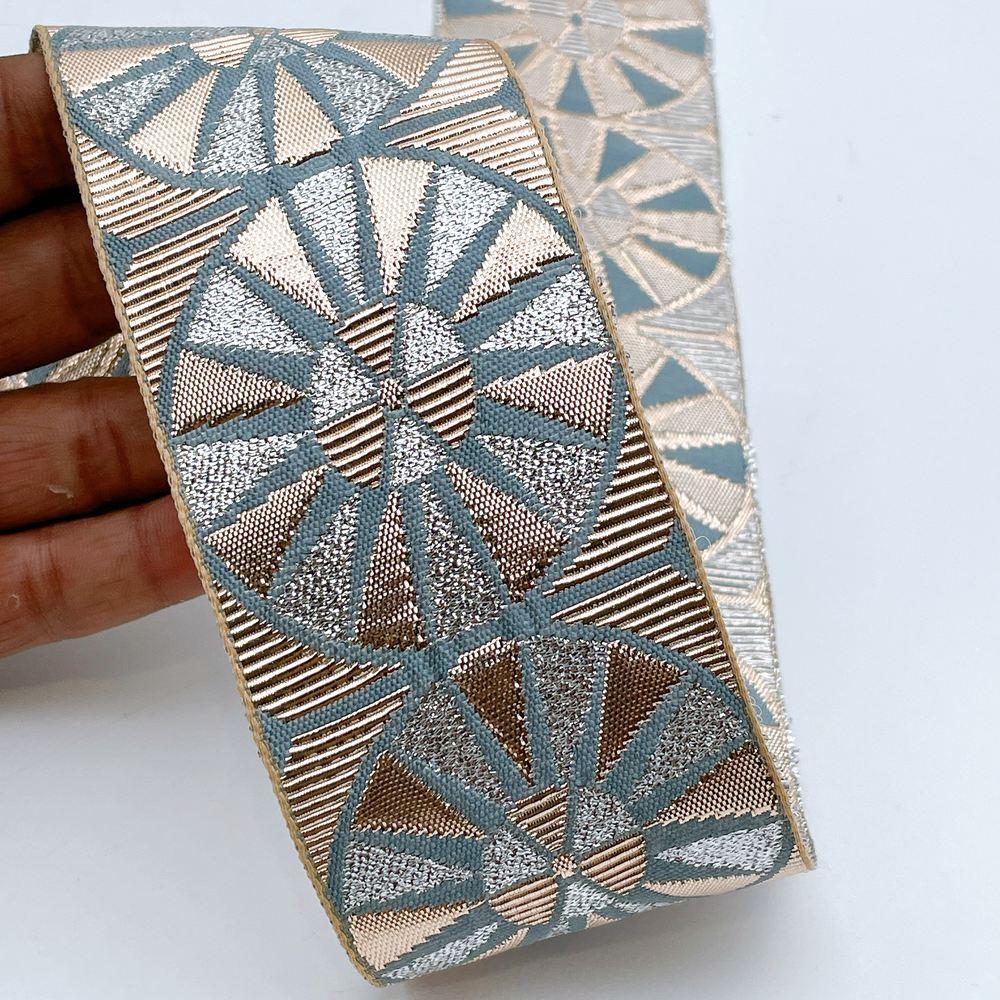 60mm Wide Colorful Sunburst Gota Work Jacquard Ribbon - Woven Border, shown on white cotton