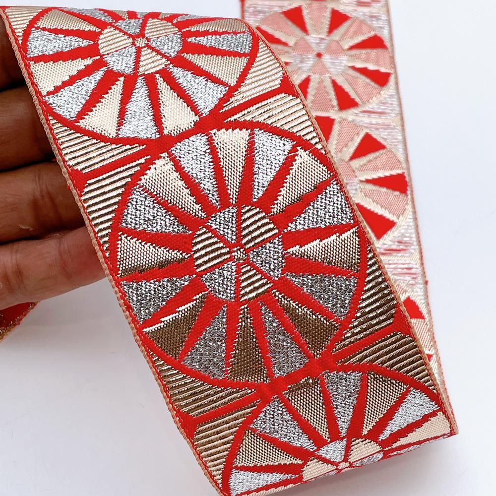 60mm Wide Colorful Sunburst Gota Work Jacquard Ribbon - Woven Border, shown on white cotton