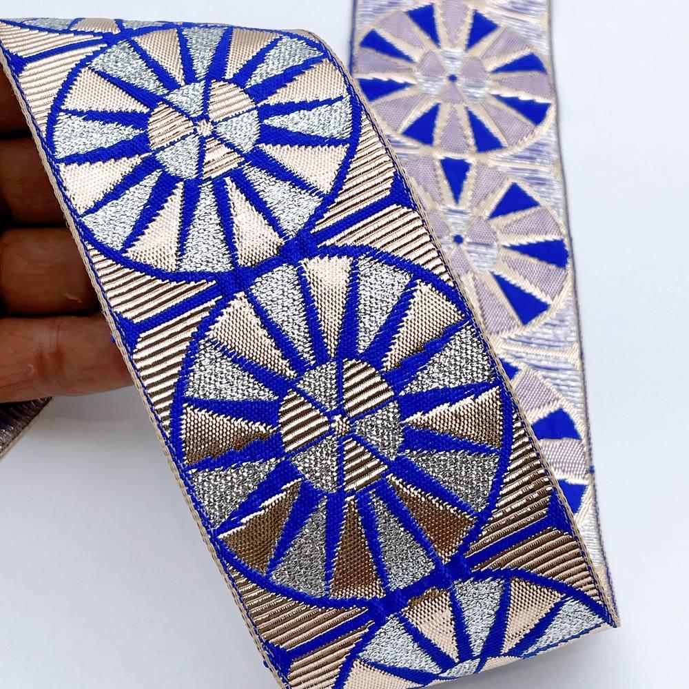 60mm Wide Colorful Sunburst Gota Work Jacquard Ribbon - Woven Border, shown on white cotton