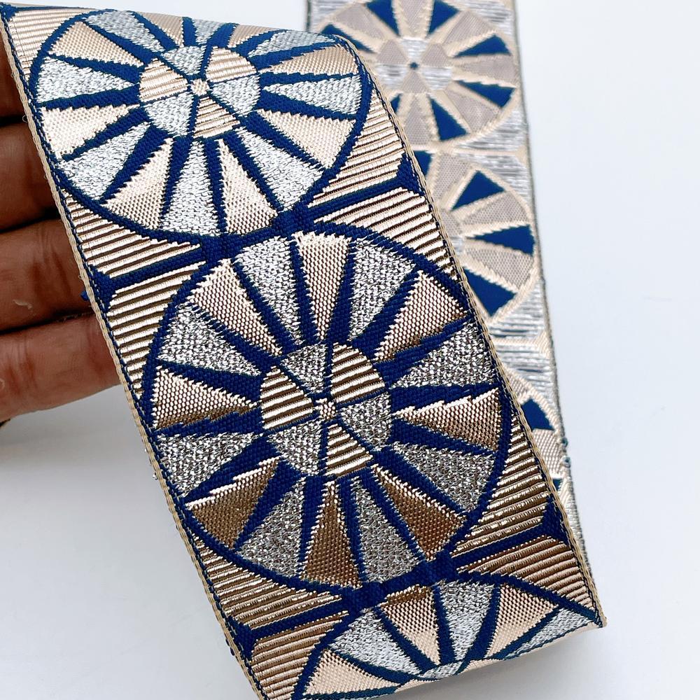 60mm Wide Colorful Sunburst Gota Work Jacquard Ribbon - Woven Border, shown on white cotton